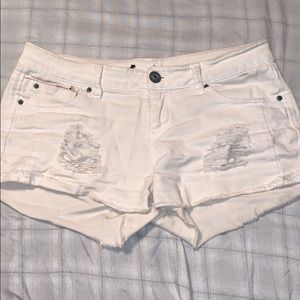 White ripped shorts